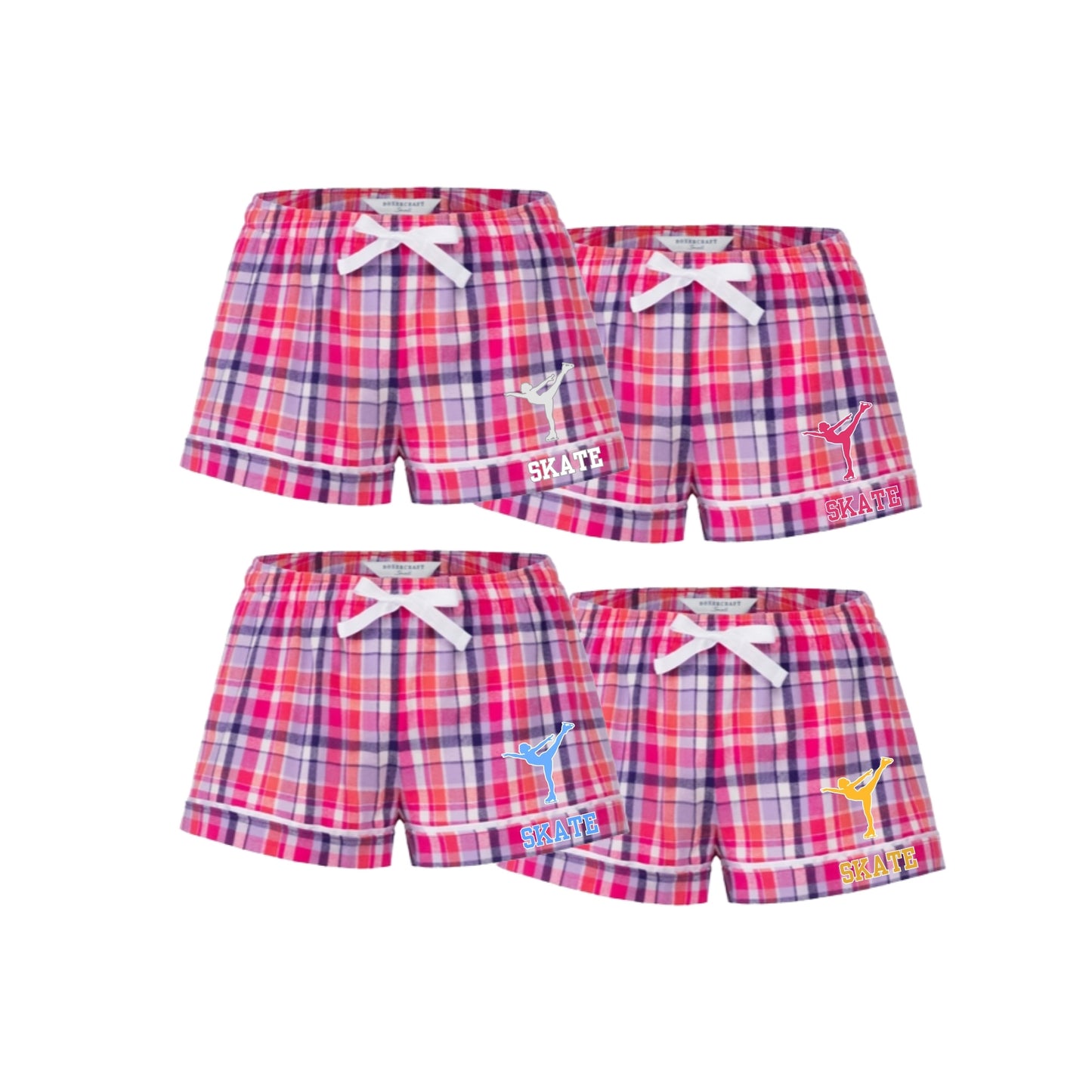 Four pairs of girls' plaid shorts arranged in a 2x2 grid on a white background. The shorts feature a pink, red, and blue plaid pattern with white drawstrings at the waist and various colorful 'SKATE' graphics on the left leg.